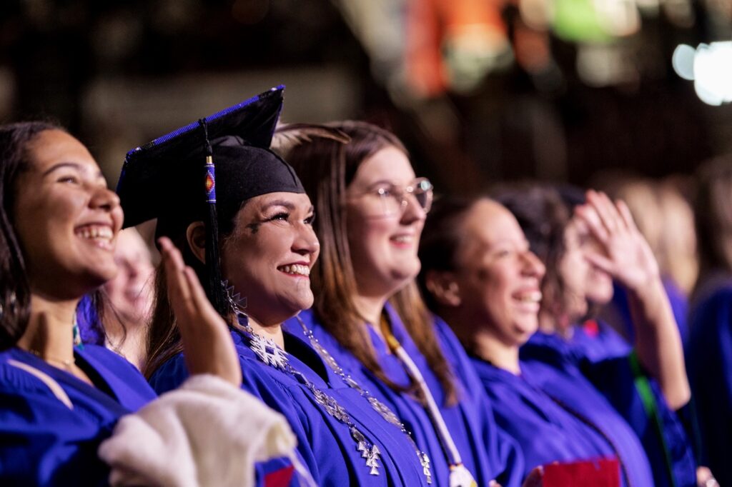 Partnerships ensure our students success; these smiling Georgian students are in blue convocation gowns ready to graduate.