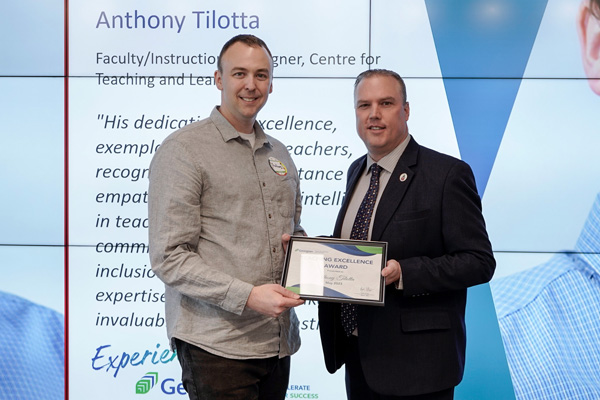 Anthony Tilotta? receiving his Teaching Excellence Award from Kevin Weaver