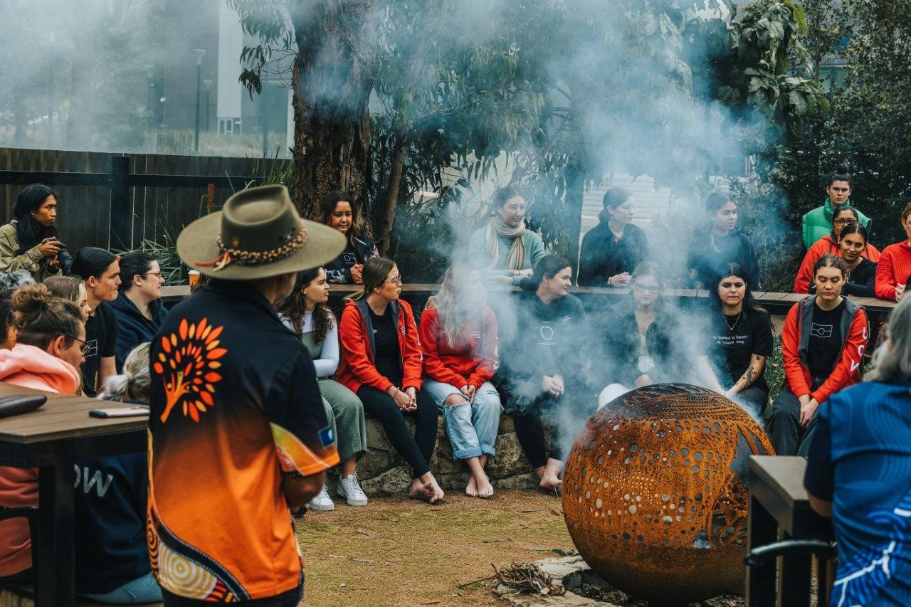 circle of people outdoors for Indigenous learning in Australia