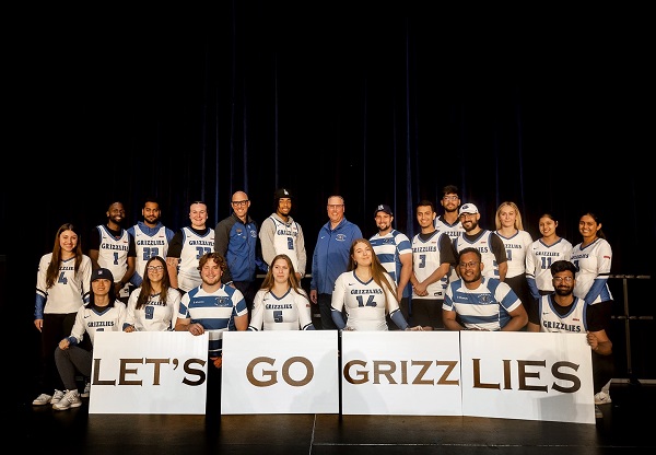Welcome to Georgian - student athletes and employees hold up Let's Go Grizzlies sign