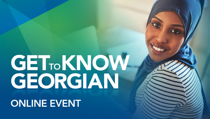 Get to Know Georgian online event: Person wearing a black and white striped shirt and a dark blue hijab, smiling while using a laptop
