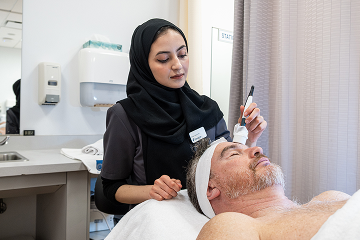 Health and Wellness student works with a client