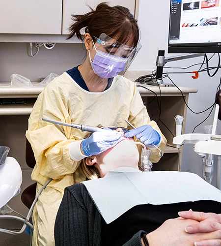 Dental student training on a patient