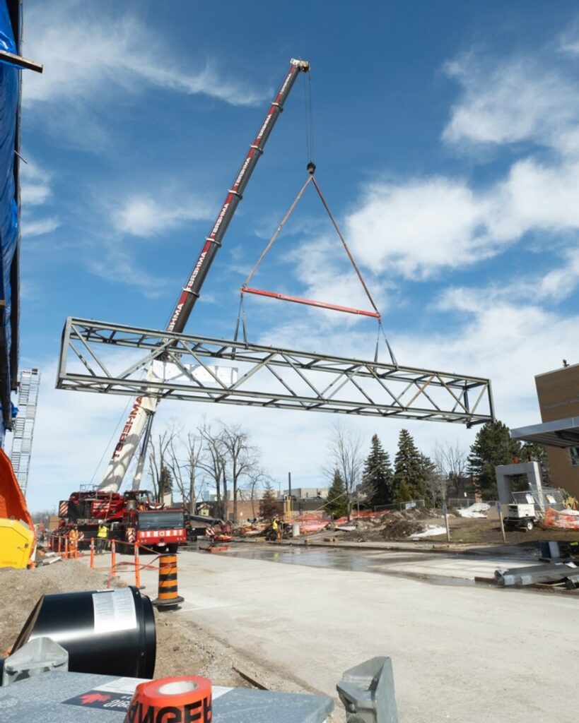 Structural bridge being lifted into place to connect Georgian’s existing campus building to the expanded Centre for Skilled Trades.