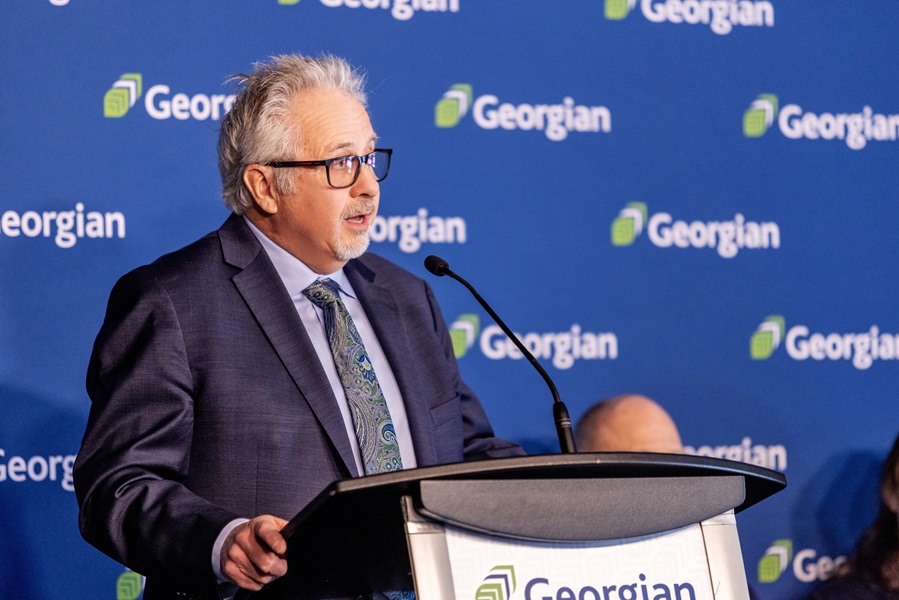 Steve Loftus at Georgian podium speaking