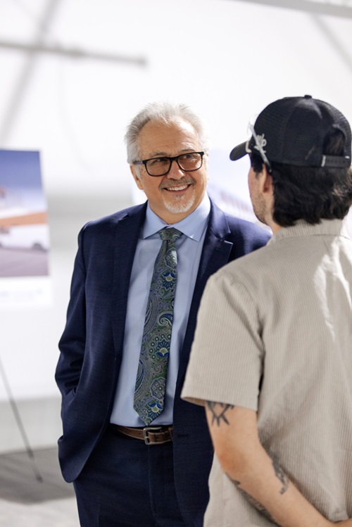 Steve Loftus, former Vice Chair of Board of Governors, interacting with student