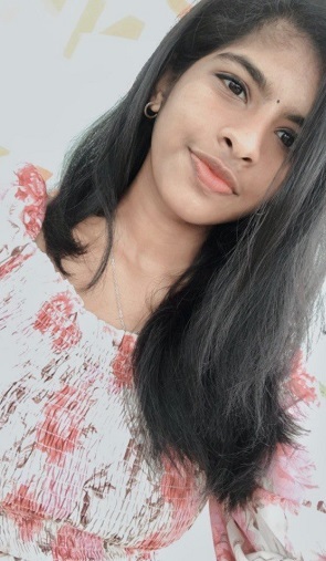 Student board representative, Karthika, selfie - young woman from India with medium-length dark hair, flowered shirt