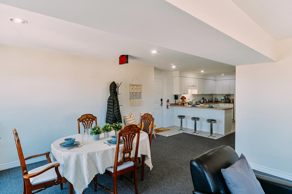 Dining room area overlooking the kitchen and entryway at the Georgian College Orillia Residence