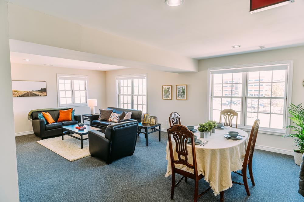 Open concept living room and dining area inside a suite at the Georgian College Orillia Residence