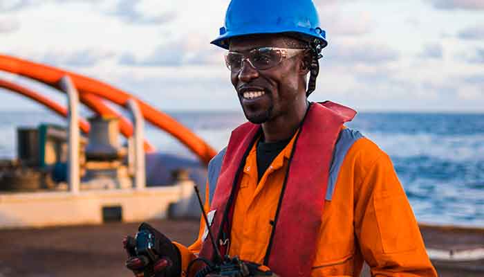 Professional sailor on deck of commercial ship